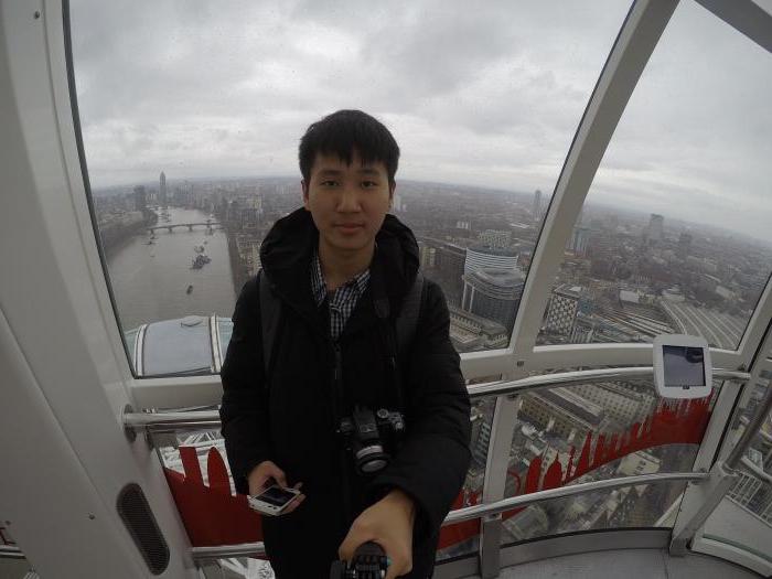 Young man taking a selfie on the London Eye